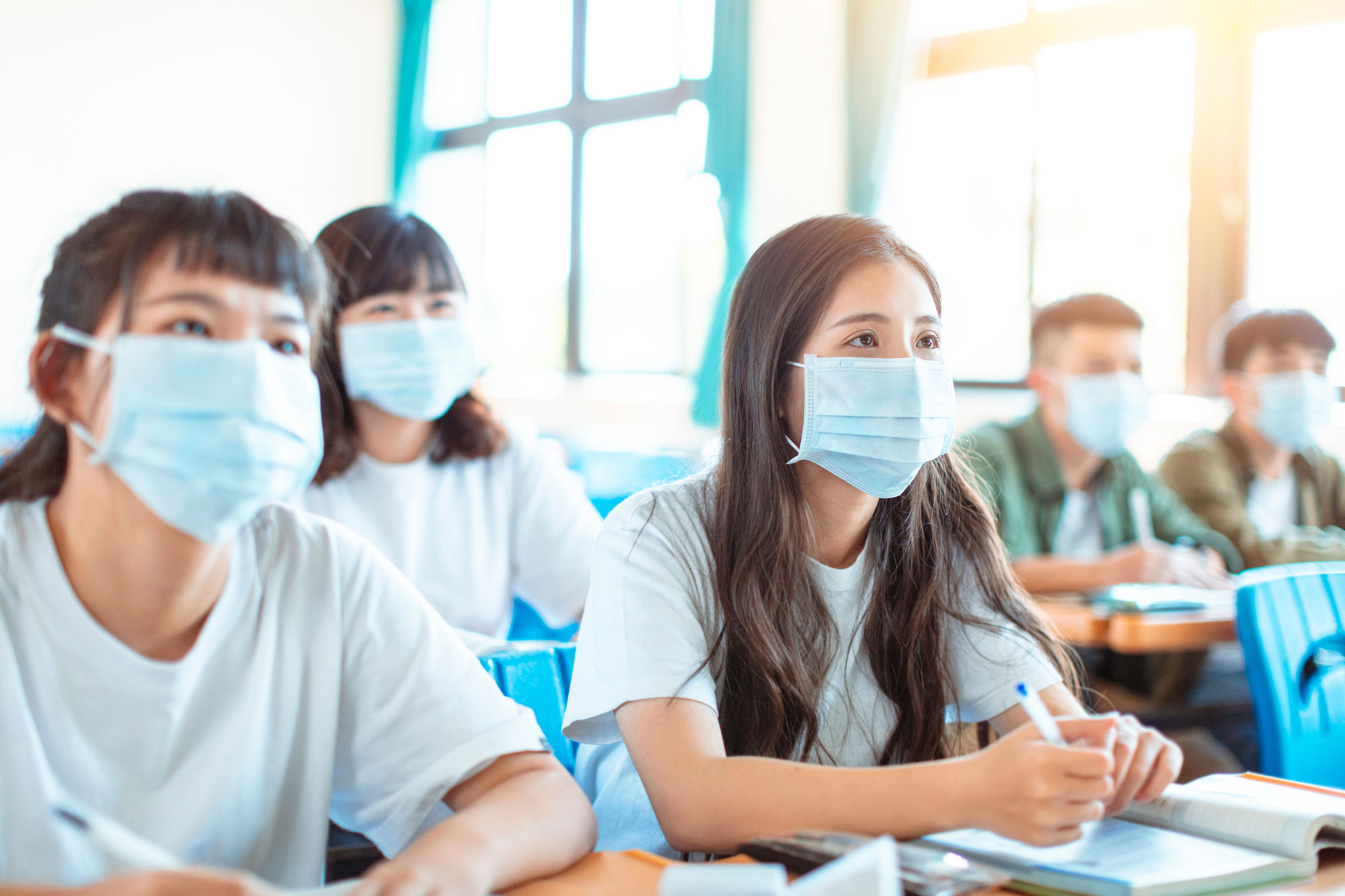 Malaysian private university students wearing a protection mask